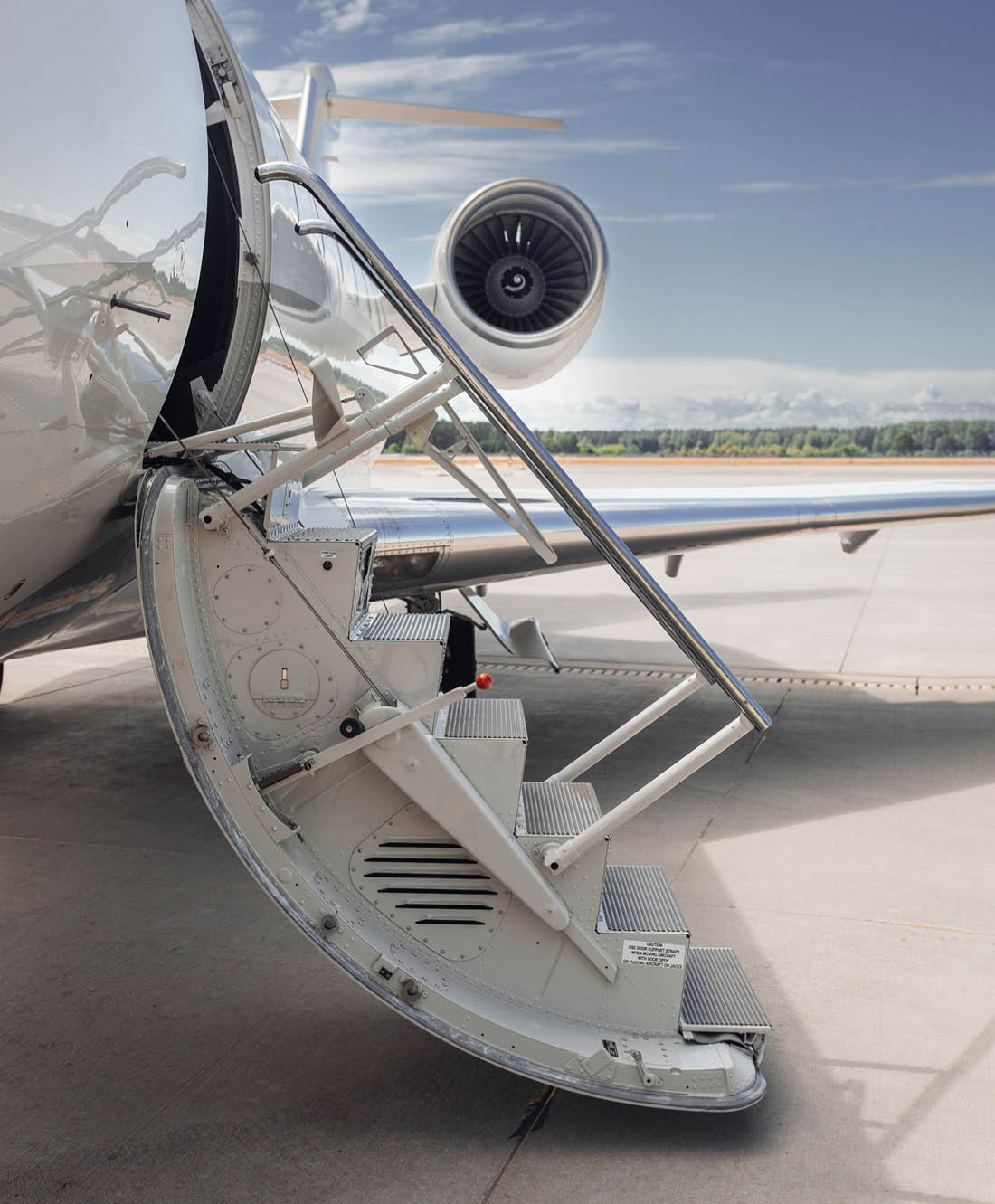 Open airstairs of a private jet at the airport. Luxury business jet 